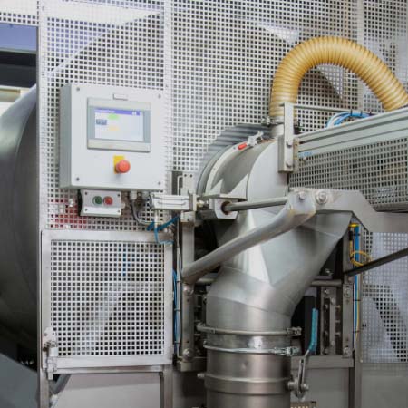 Hoses, controls, switches and display of a large machine for processing plant raw materials